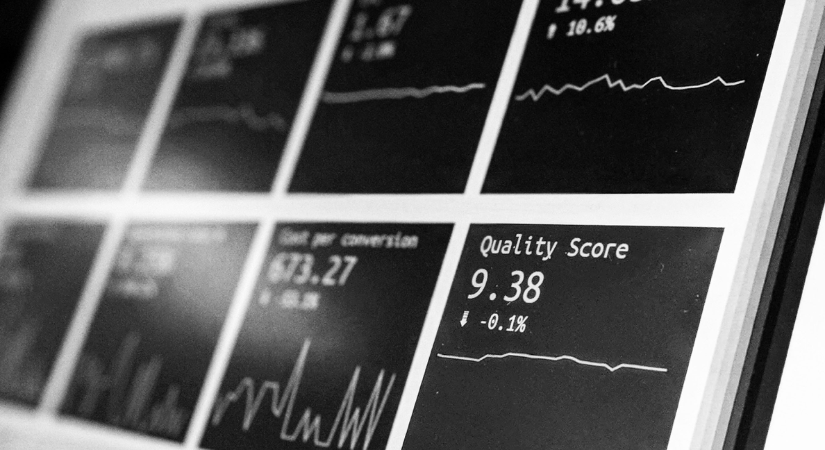 Black and white image of line charts on a screen