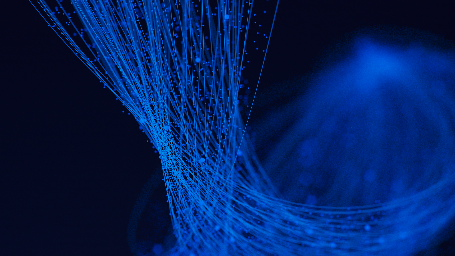 Swirls of blue light against black background