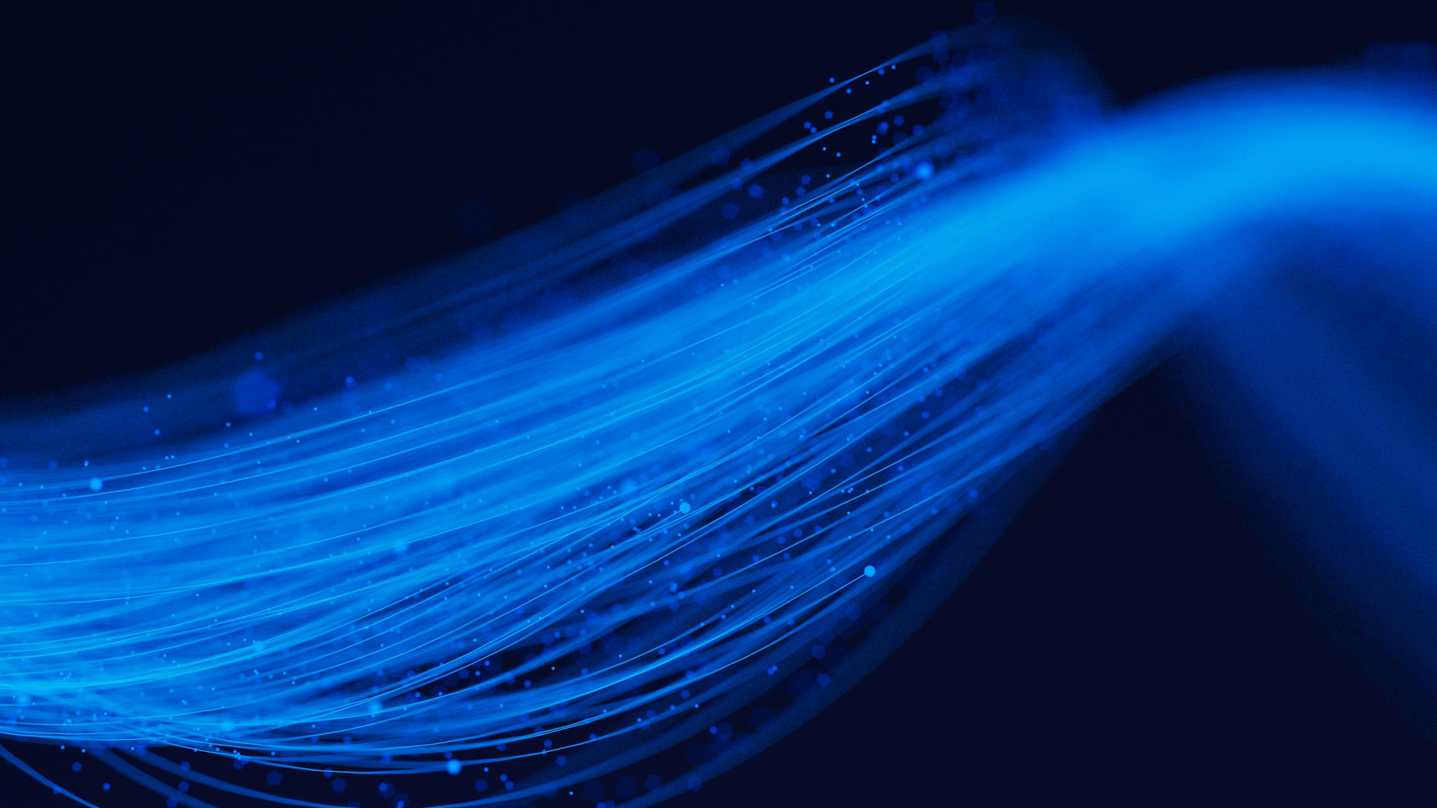 Swirls of blue light on black background